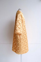 60's yellow gold quilted coat